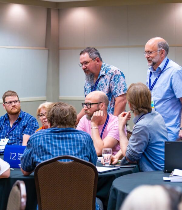 Group of members gathered around a table